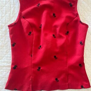 Red corset type top with embroidered black flowers